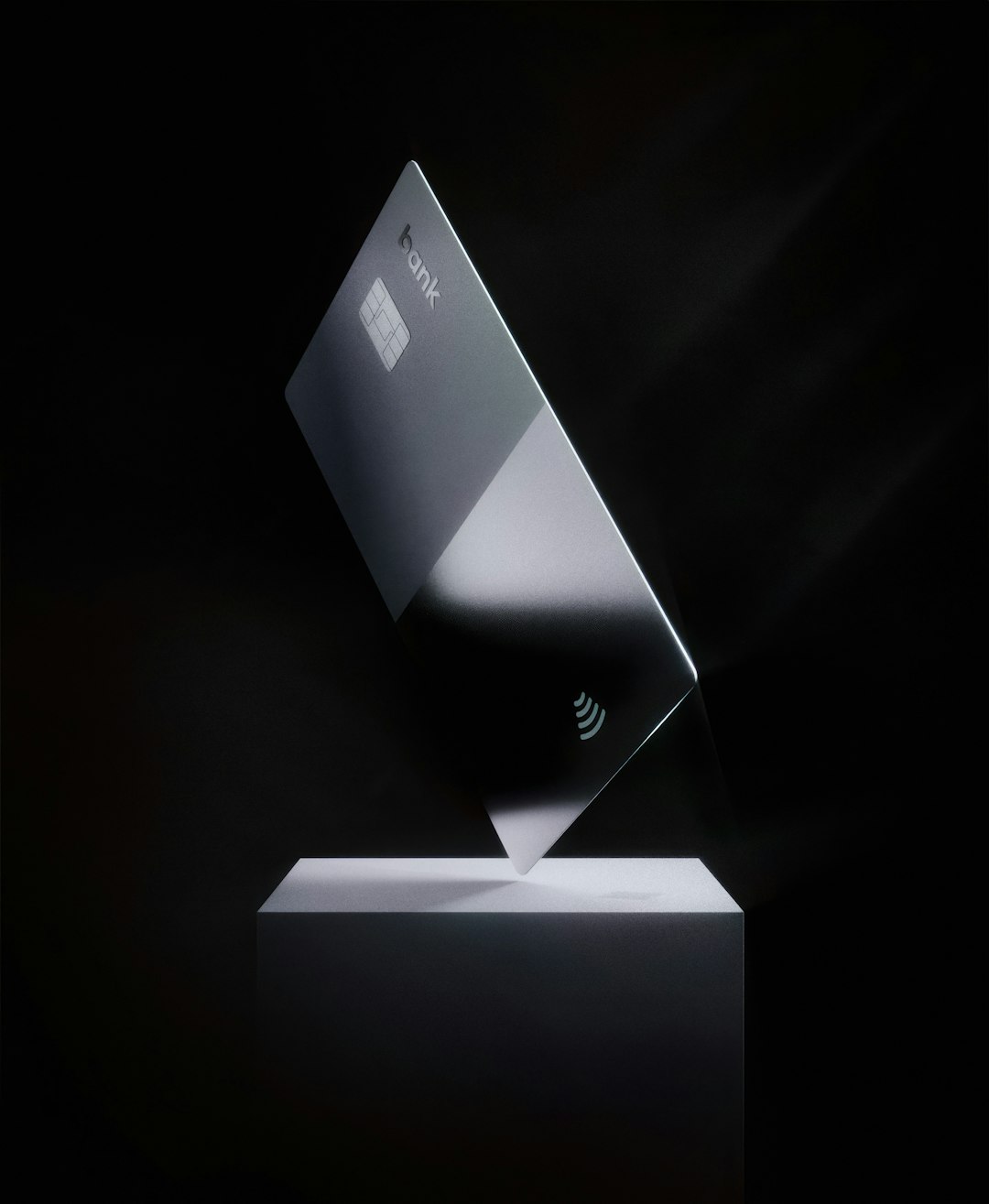 Glossy bank card flying upon the monolith
